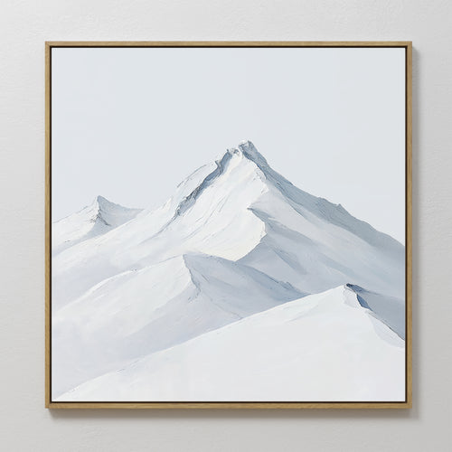 The Alpine Ascent Abstract Canvas Art features snow-capped mountain peaks and soft blue-gray shadows, making it a serene, minimalist wall decor choice for any modern living room.