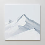 Alpine Ascent Abstract Canvas Art showcases minimalist snow-capped mountain peaks with soft blue and gray tones, sharp ridges, and gentle gradients—ideal for adding serene style to your living room décor.