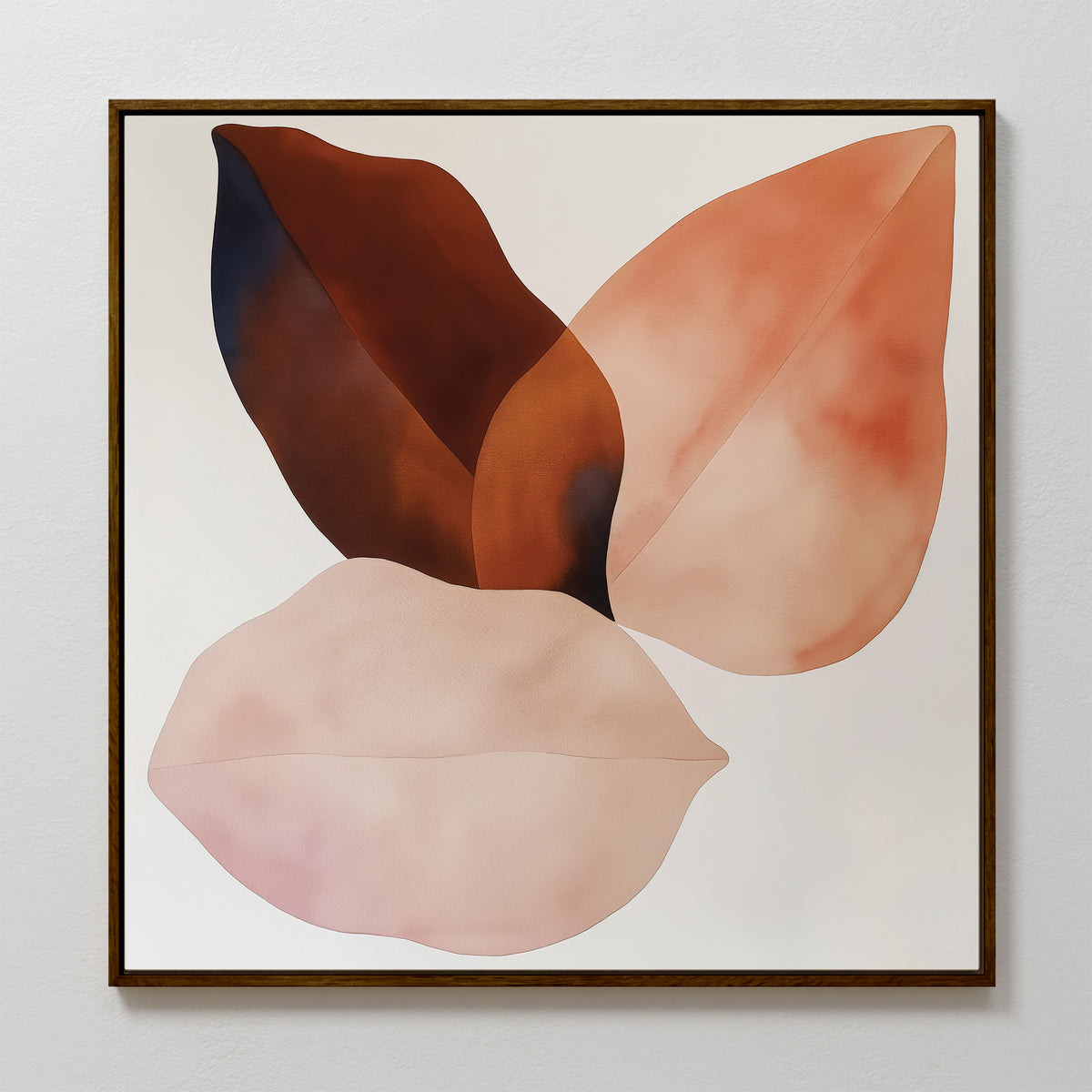 The Autumn Petals Canvas Art features three abstract, overlapping leaf shapes in soft pink, peach, and brown on a white background, all elegantly framed with a thin dark border for a minimalist look.