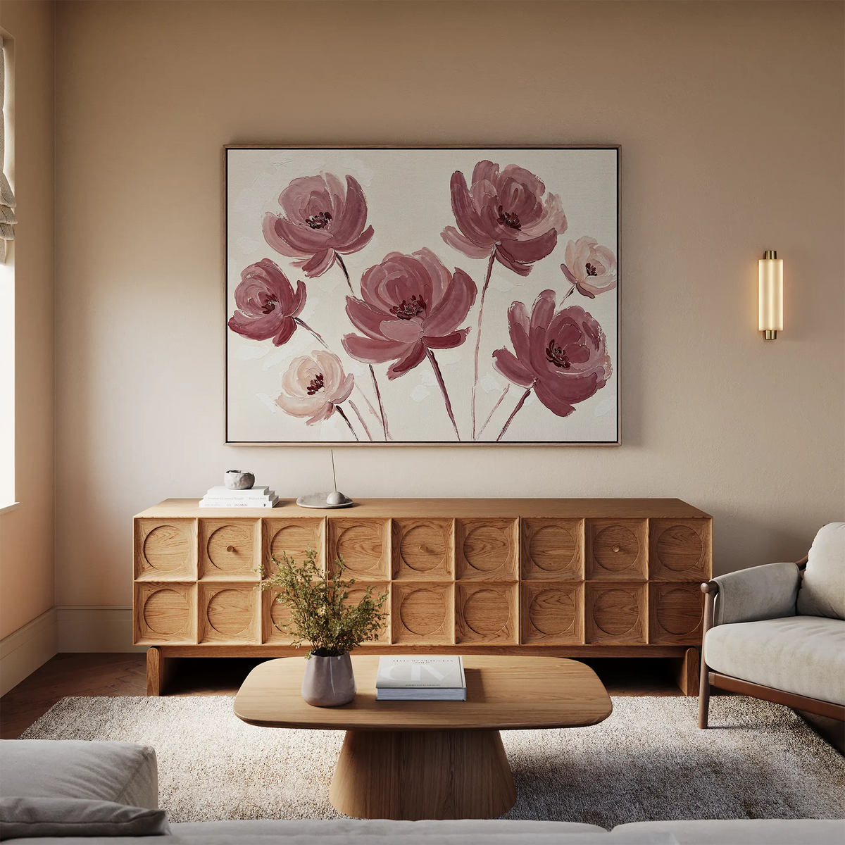 A cozy living room with beige walls, a wooden sideboard, a light sofa, and a wooden coffee table. The Autumn Rose Canvas Art featuring vintage-style pink flowers hangs above the sideboard as soft natural light fills the space.