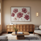 A cozy living room with beige walls, a wooden sideboard, a light sofa, and a wooden coffee table. The Autumn Rose Canvas Art featuring vintage-style pink flowers hangs above the sideboard as soft natural light fills the space.