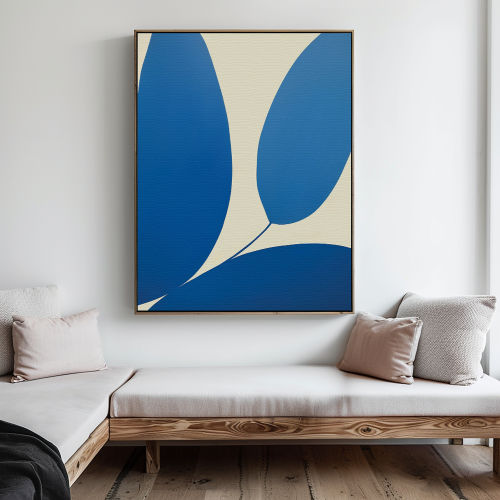 A modern living room features a wooden bench with light cushions and pillows beneath the Azure Sweep Abstract Canvas Art, which displays curved blue, cream, and white shapes on a minimalist white wall.