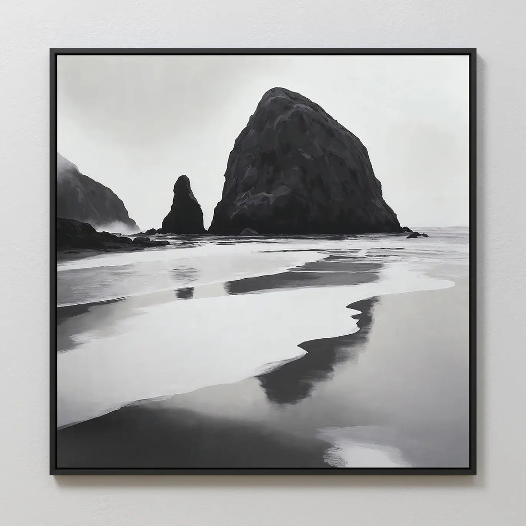 Basalt Beach Canvas Art: a black and white framed photo featuring large rocky sea stacks and reflective wet sand, creating a calm, misty scene—ideal minimalist wall décor for coastal homes.