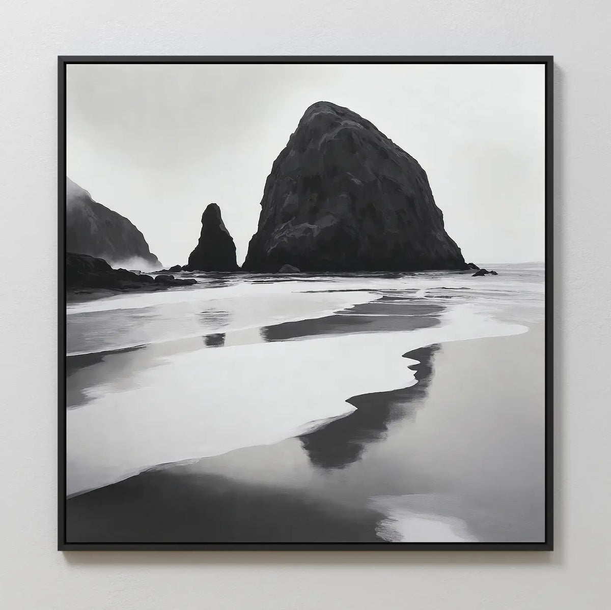 Basalt Beach Canvas Art: a black and white framed photo featuring large rocky sea stacks and reflective wet sand, creating a calm, misty scene—ideal minimalist wall décor for coastal homes.