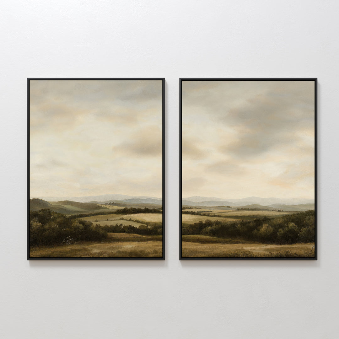 The Beneath The Clouds Set of 2 features framed landscape wall art canvases with rolling hills, fields, and distant mountains beneath a cloudy sky in soft green, brown, and beige tones.