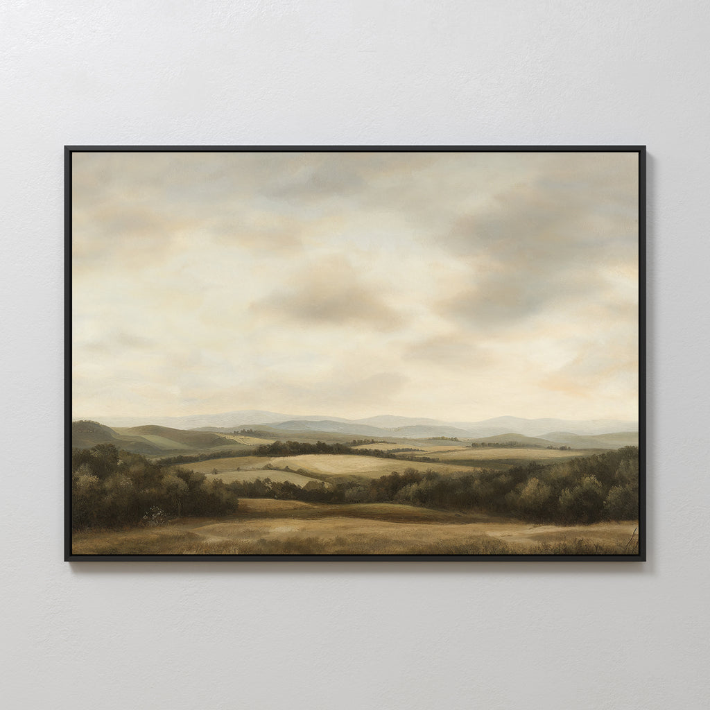 Beneath The Clouds Canvas Art is a minimalist wall piece featuring rolling hills, distant mountains, and fields beneath a cloudy sky, rendered in soft muted colors.