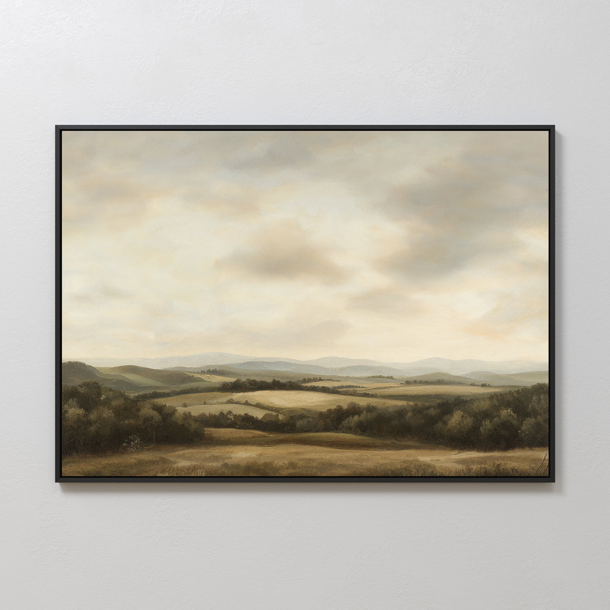 Beneath The Clouds Canvas Art is a minimalist wall piece featuring rolling hills, distant mountains, and fields beneath a cloudy sky, rendered in soft muted colors.
