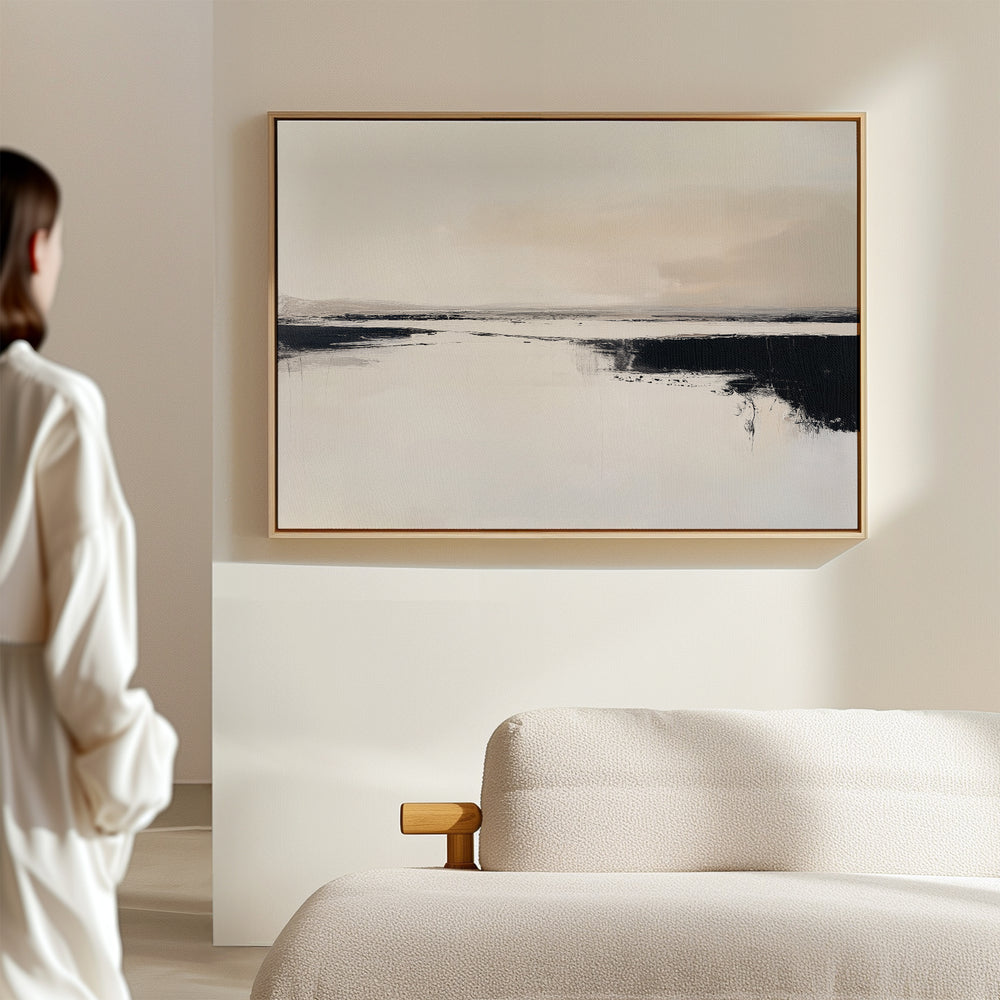 A woman in a white outfit stands in a modern, minimal space, admiring the Binary Calm Abstract Canvas Art – Horizontal with soft, neutral tones displayed above a light-colored sofa.