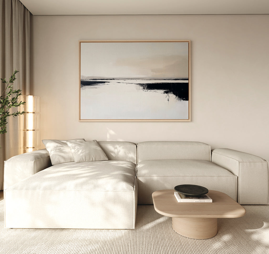 A modern living room with a light beige sectional sofa, a wooden coffee table with a black dish, and the Binary Calm Abstract Canvas Art – Horizontal as large minimalist wall art, set against neutral walls with soft natural light.