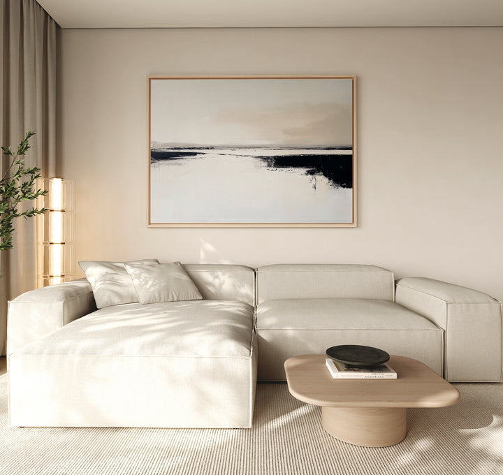A modern living room with a light beige sectional sofa, a wooden coffee table with a black dish, and the Binary Calm Abstract Canvas Art – Horizontal as large minimalist wall art, set against neutral walls with soft natural light.