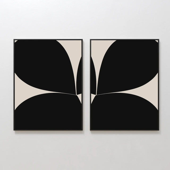The Minimal Petal Set of 2 features abstract black and beige prints with curved shapes that create a bold, symmetrical, mirrored design, perfect for adding minimalist style to your wall.