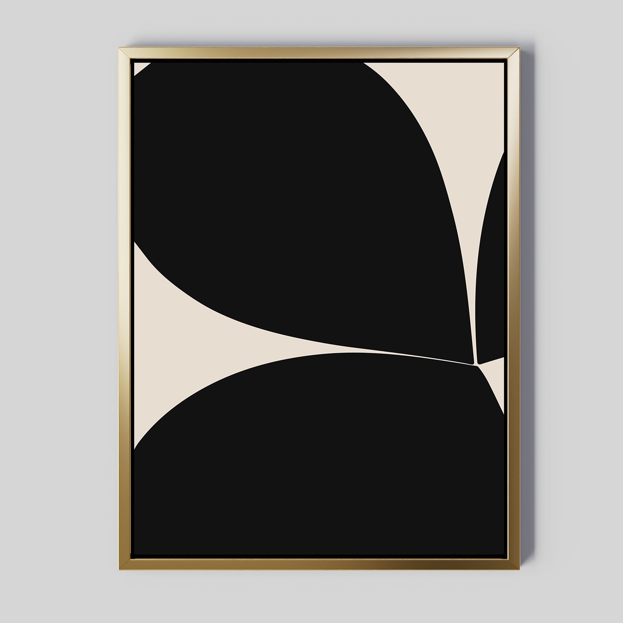 Black Botanical Abstract Canvas Art in a gold frame features bold black abstract shapes with curved edges on a cream background, creating contemporary wall art for your space.