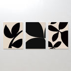 The Black Botanical Set of 3 features minimalist art prints with abstract black leaf shapes on beige and black backgrounds, creating striking botanical wall art when displayed together.