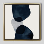 Blue Currents Canvas Art is a minimalist, modern wall art print with three overlapping organic shapes in dark navy and light gray on white, framed in a square gold frame—perfect for adding stylish decor to any space.