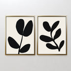 The Black Leaf Set of 2 features minimalist prints with unique black leaf abstract designs on a white background—an elegant botanical wall art choice for any space.