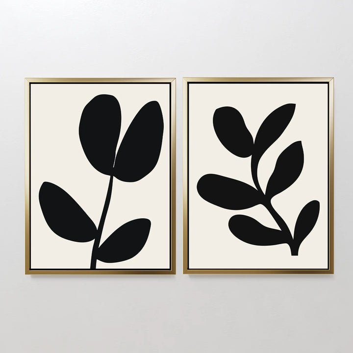 The Black Leaf Set of 2 features minimalist prints with unique black leaf abstract designs on a white background—an elegant botanical wall art choice for any space.