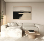 A modern living room with a beige sectional sofa, light wood coffee table, and Black Shore Canvas Art – Horizontal hanging above. Sheer curtains and a tall plant to the left complete the decor.