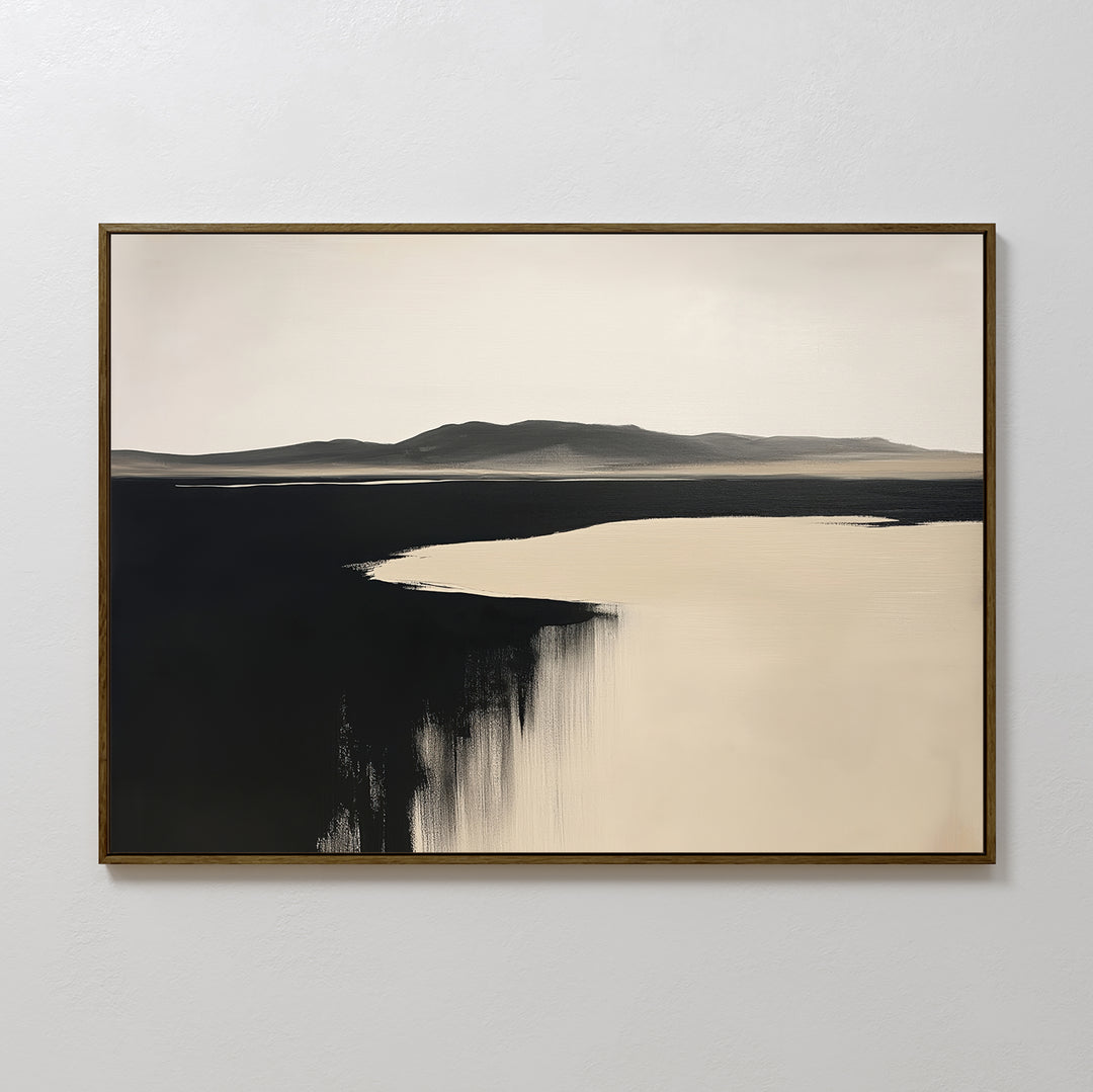 Black Shore Canvas Art – Horizontal features a minimalist landscape with distant mountains, dark foreground, and pale sky. Framed and displayed on a white wall, it’s ideal minimalist wall art for modern living room decor.