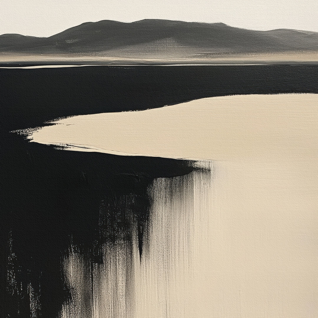 Black Shore Canvas Art features an abstract landscape with dark mountains, a light sky, and bold black and beige accents. This minimalist wall art adds tranquility to any modern living room decor.