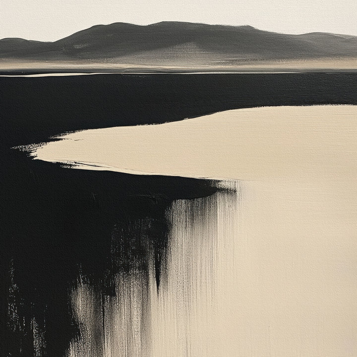 Black Shore Canvas Art features an abstract landscape with dark mountains, a light sky, and bold black and beige accents. This minimalist wall art adds tranquility to any modern living room decor.