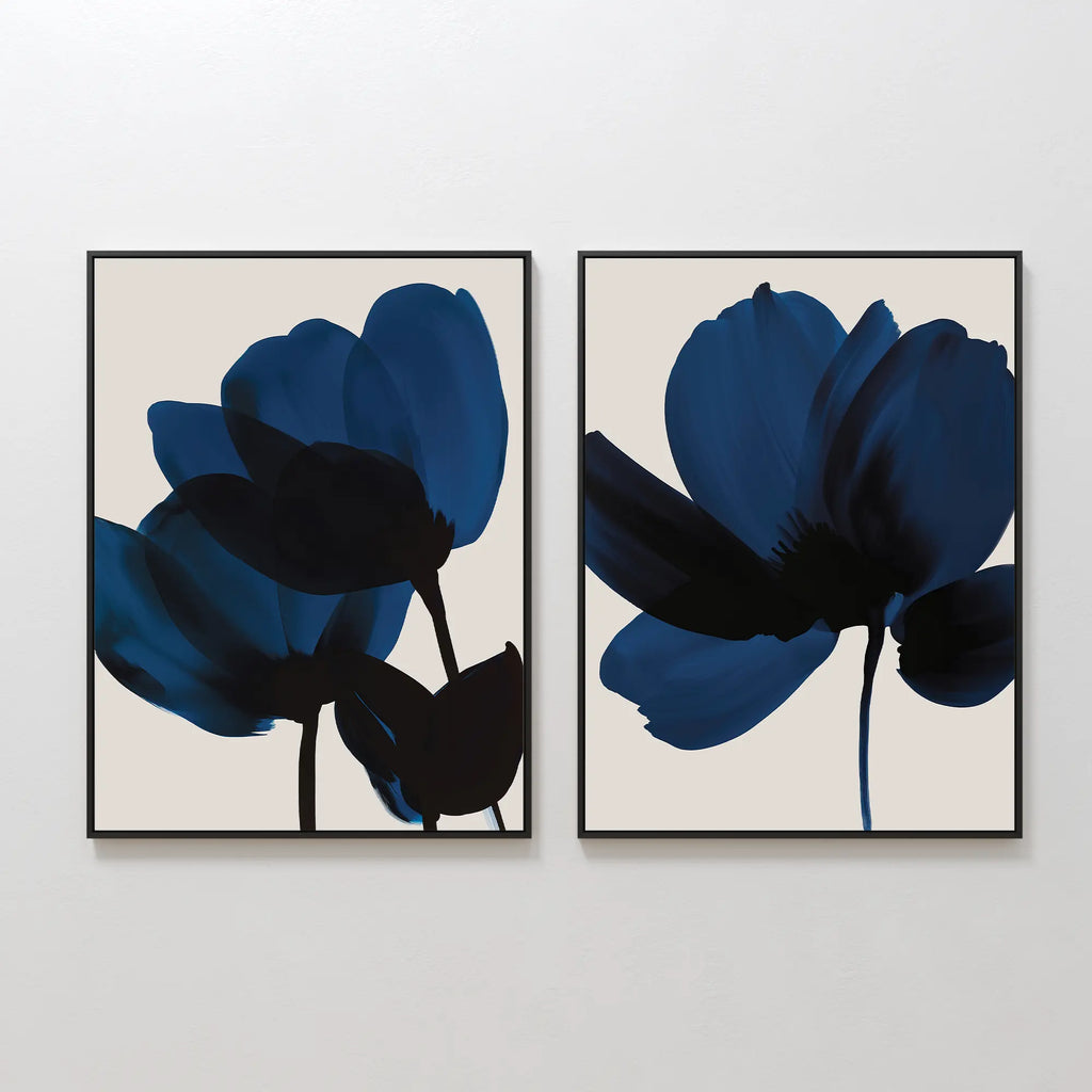 The Bloom Set of 2 features abstract dark blue flower silhouettes on light beige backgrounds in matching frames—ideal floral wall art to enhance your contemporary space.