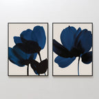 The Bloom Set of 2 features abstract dark blue flower silhouettes on light beige backgrounds in matching frames—ideal floral wall art to enhance your contemporary space.