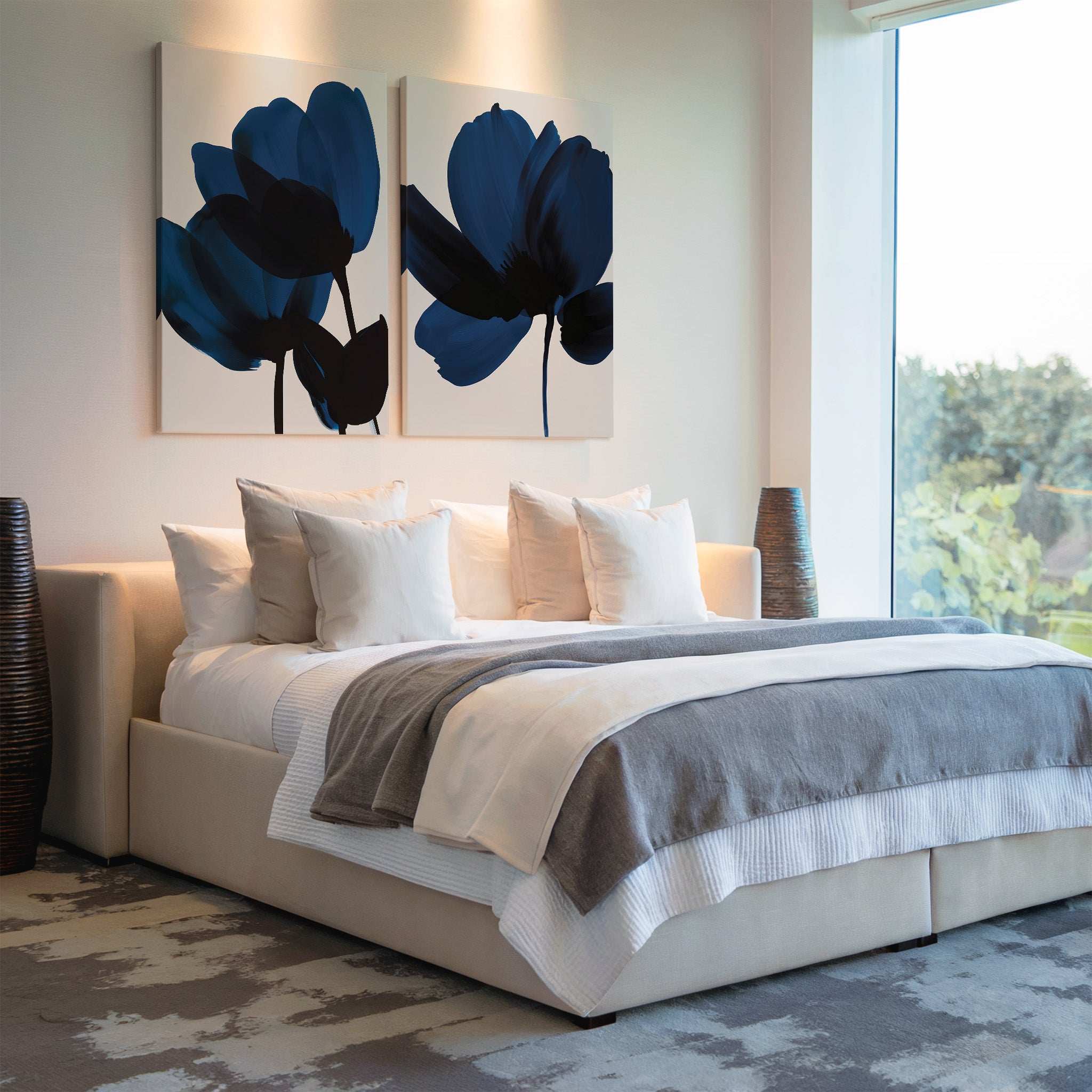 Modern bedroom with a beige bed, white and gray bedding, multiple white pillows, and the Bloom Set of 2 floral wall art above the bed for a Nordic Park-inspired touch. Large window lets in natural light.
