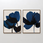 The Bloom Set of 2 features framed prints with abstract dark blue flowers and black stems on a light beige background, displayed side by side—ideal for adding contemporary wall art to your space.