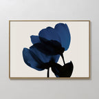 Bloom Abstract Canvas Art – Horizontal features two abstract blue flowers with black stems on a light beige background, framed in thin gold. Its modern design and overlapping soft-edged petals make it ideal for living room decor.