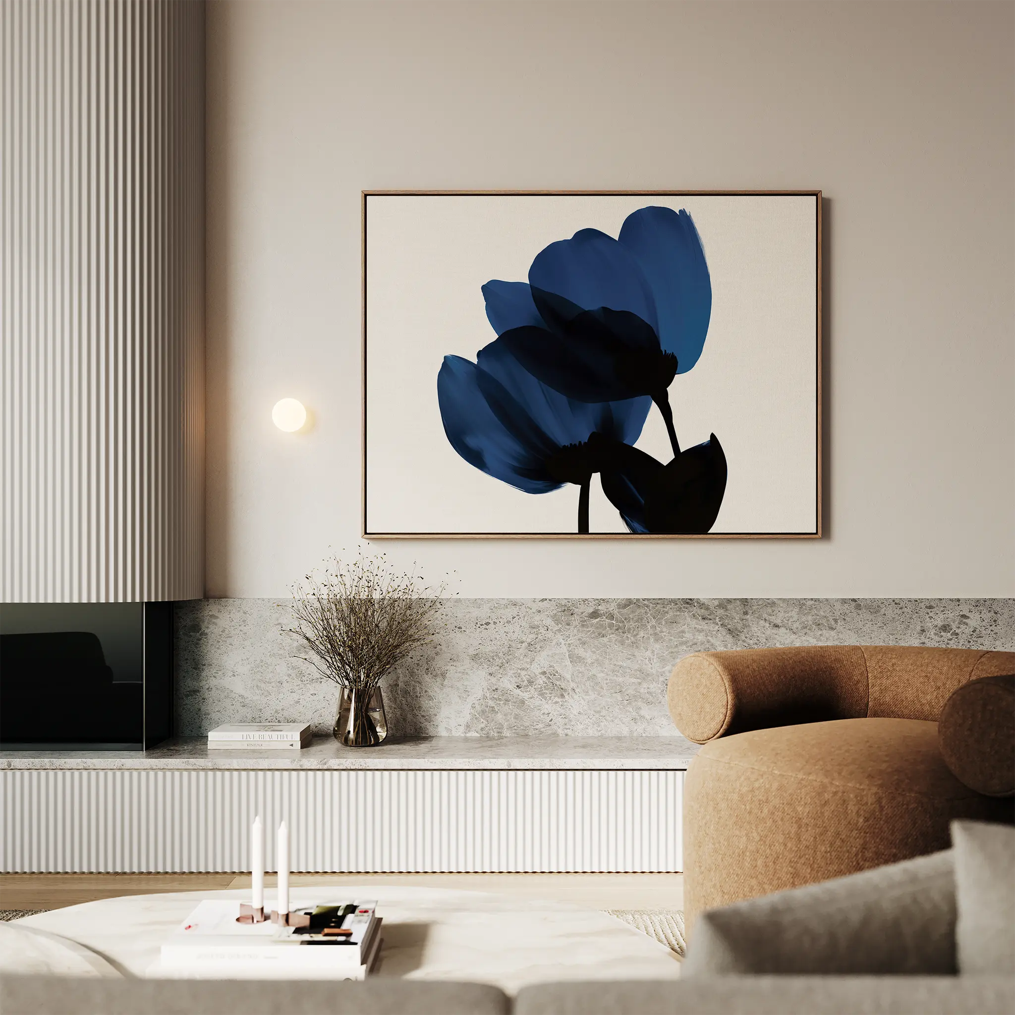 A modern living room with a beige armchair, marble surfaces, dried flowers in a vase, and the Bloom Abstract Canvas Art – Horizontal—a large blue floral painting—hanging above a built-in shelf for elegant decor.