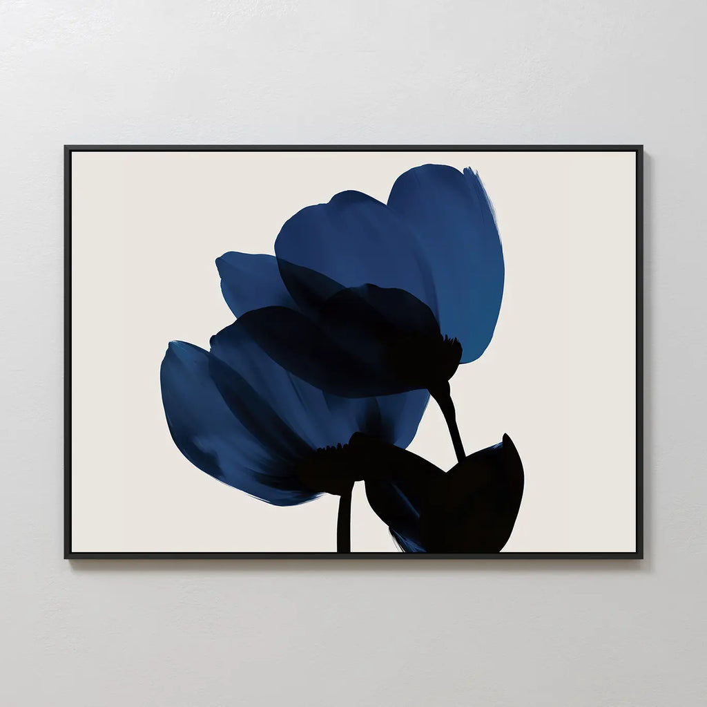 Bloom Abstract Canvas Art – Horizontal features two abstract dark blue flowers with black stems and leaves on a light beige background, framed with a slim black border—ideal modern wall art for your living room decor.
