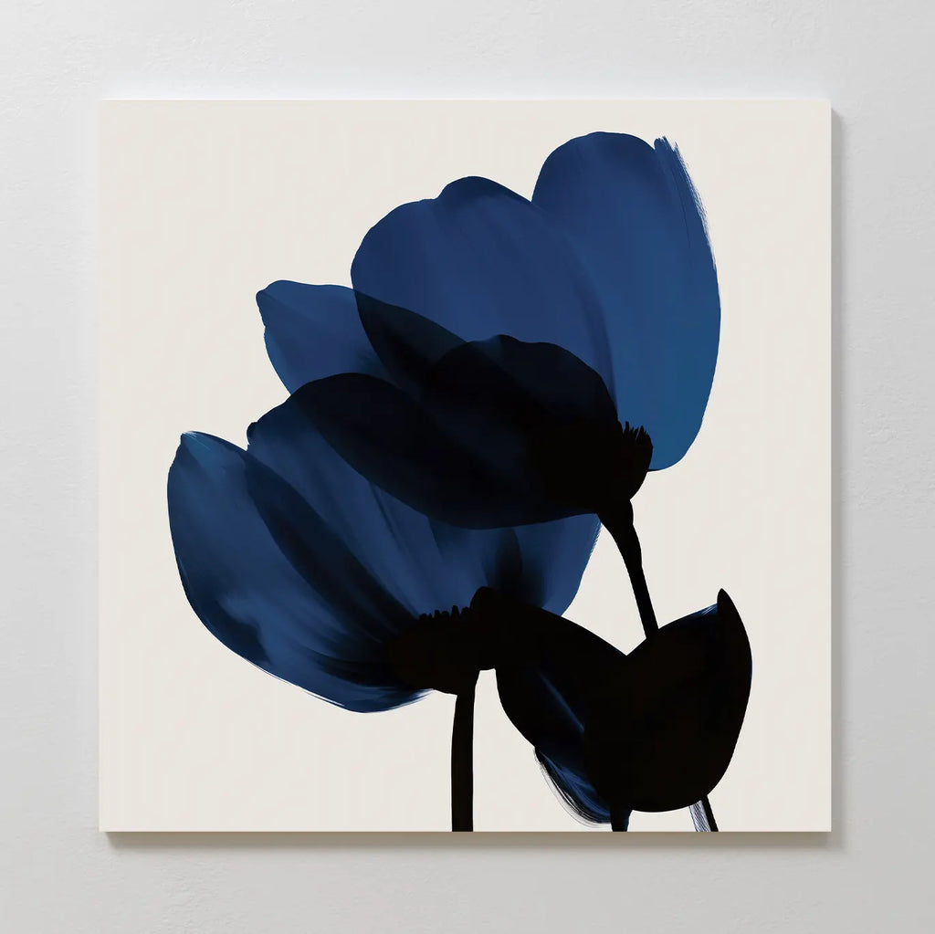 Bloom Abstract Canvas Art – Square features two dark blue flowers with black stems on a light beige background. Soft, fluid brushstrokes give this modern piece an abstract touch, making it ideal for enhancing your living room decor.