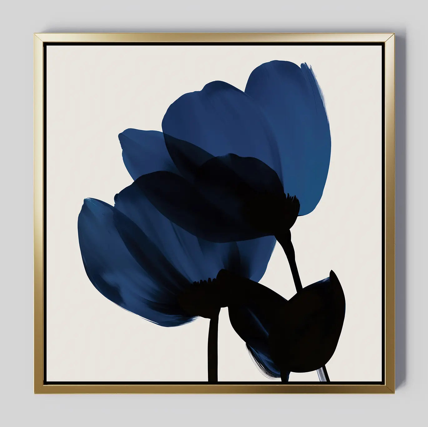 Bloom Abstract Canvas Art – Square: Minimalist wall art featuring two dark blue and black abstract flowers with soft, broad petals on a light beige background, framed in an elegant gold-bordered square—ideal for modern living room decor.