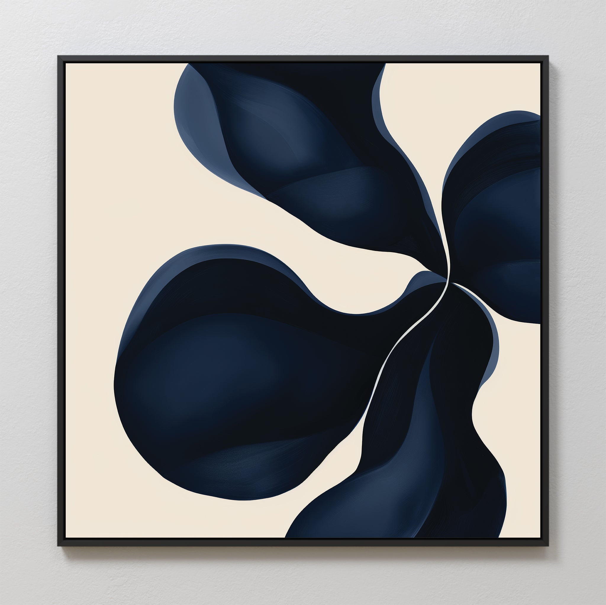 Blossom Blue Abstract Canvas Art features four bold, dark blue shapes swirling on a pale beige background in a thin black frame—a perfect piece of minimalist wall art for any space.