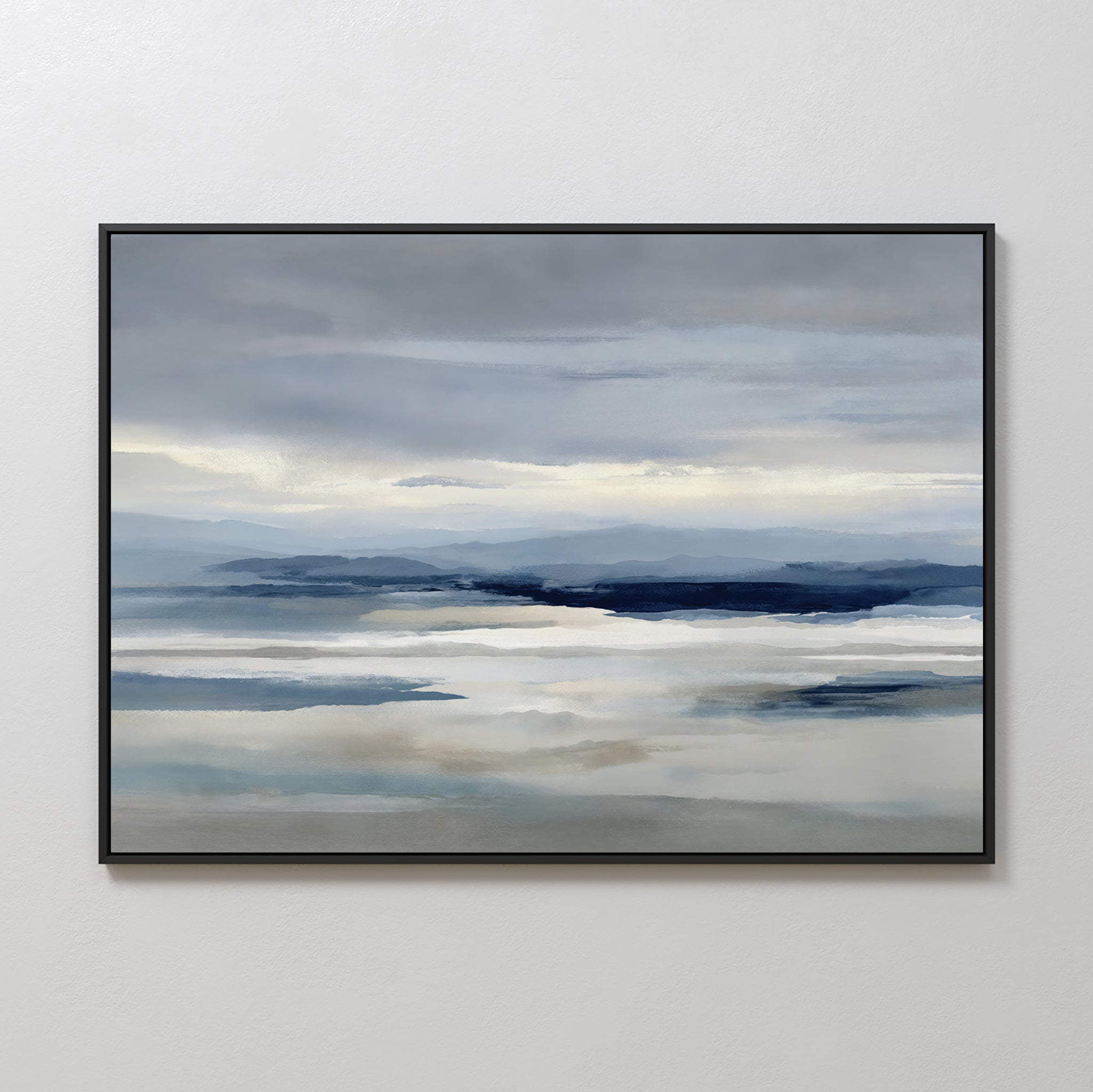 Blue Mist Horizon Canvas Art: a framed canvas featuring serene blues and grays with calm water, distant mountains, and a cloudy sky—ideal minimalist wall art for tranquil living room decor.