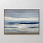 The Blue Mist Horizon Canvas Art features minimalist blue, gray, and white tones in a serene landscape of calm water and distant mountains, creating a tranquil atmosphere perfect for living room decor.