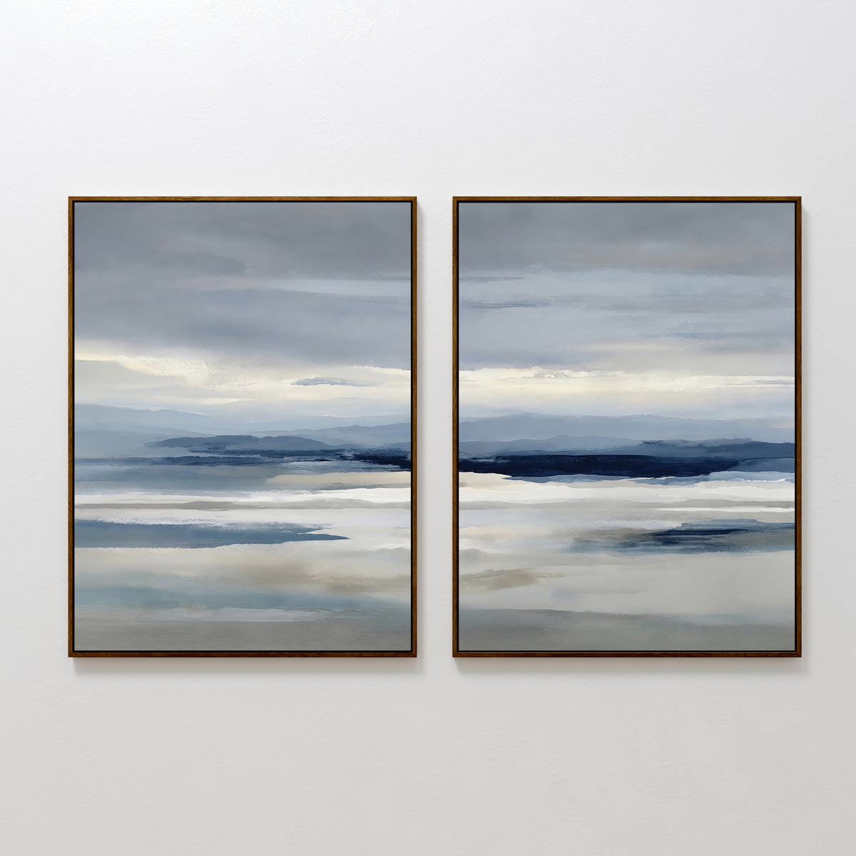 The Blue Mist Horizon Set of 2 features framed, minimalist abstract landscapes in layered blue, gray, and beige. These large canvas prints resemble misty water and distant mountains, perfect as modern wall art for living room decor.