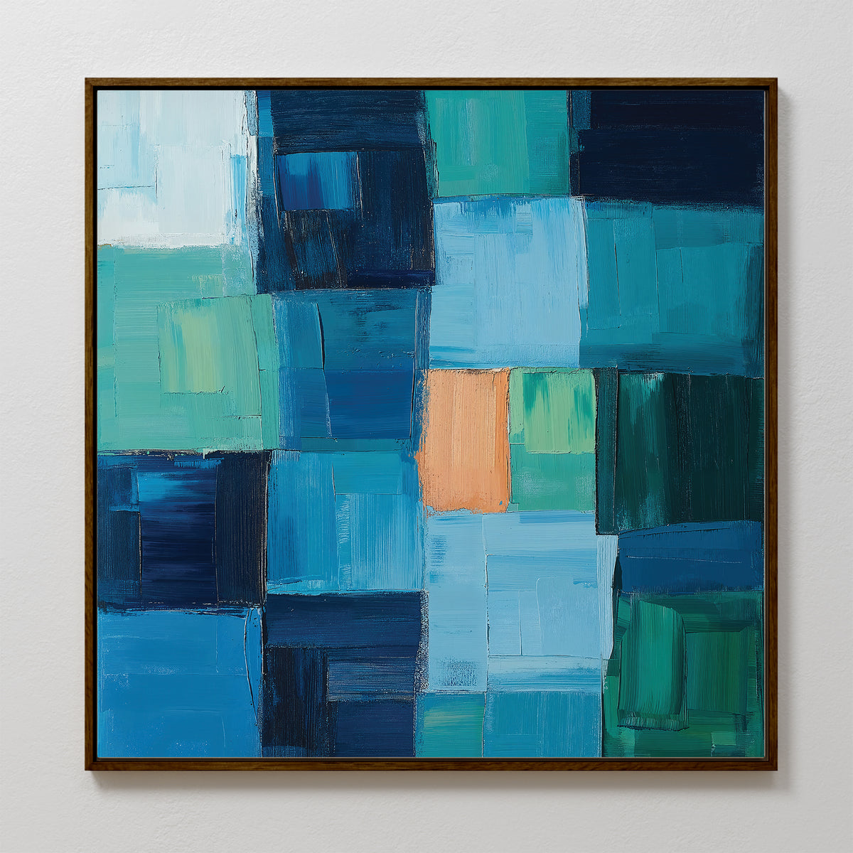 Blue Mosaic Abstract Canvas Art features a grid of overlapping blue, teal, and green rectangles with a central orange accent. This framed piece makes striking living room decor.