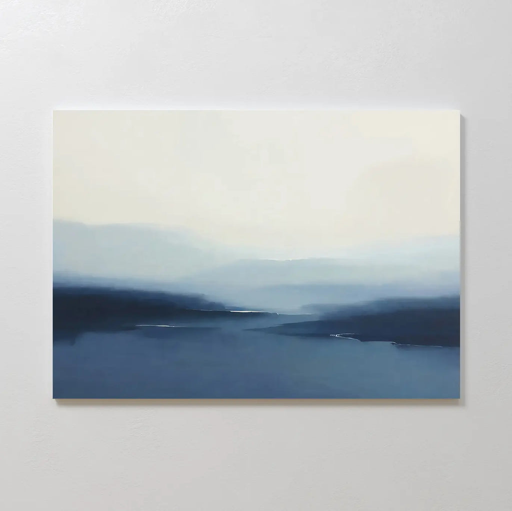 Blue Valley Mist Canvas Art features soft, blurry blue and white tones that evoke a misty landscape of distant hills or water beneath a pale sky—ideal for adding calming, minimalist decor to your space.