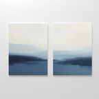 The Blue Valley Mist Set of 2 features square abstract prints with misty blue and white landscapes, soft lines evoking distant mountains and water under a pale sky—ideal minimalist wall art for any space.