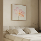 A neatly made bed with white pillows and bedding sits against a beige wall, topped by the Blush Magnolia Canvas Art. A bare decorative branch in the corner adds to the room’s calm, minimalist vibe.