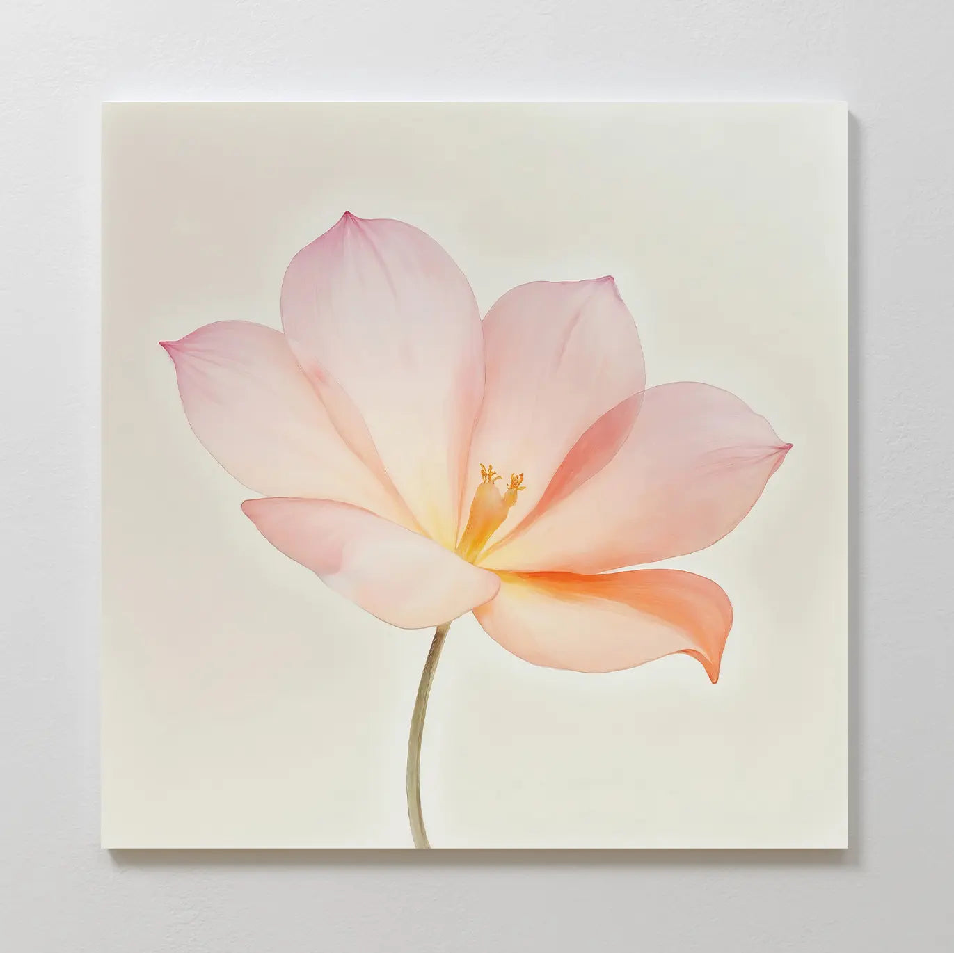 Blush Magnolia Canvas Art: A square minimalist canvas featuring a pastel pink and peach magnolia with delicate petals and a light green stem on a pale background—ideal floral wall art for bedroom decor.
