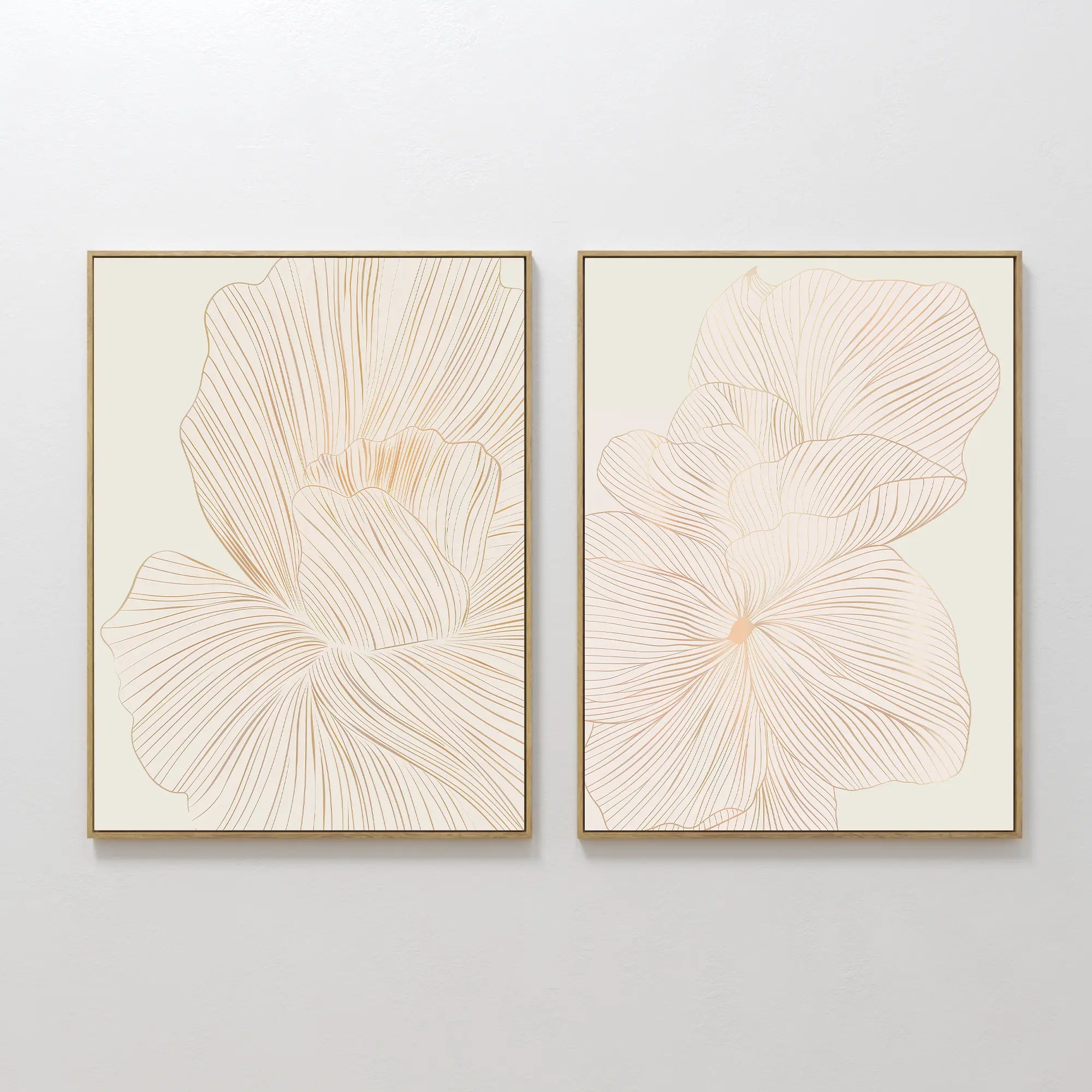The Blush Sketch Set of 2 features framed minimalist line drawings of large, delicate flowers in soft beige, displayed side by side for elegant wall art that enhances modern bedroom decor.