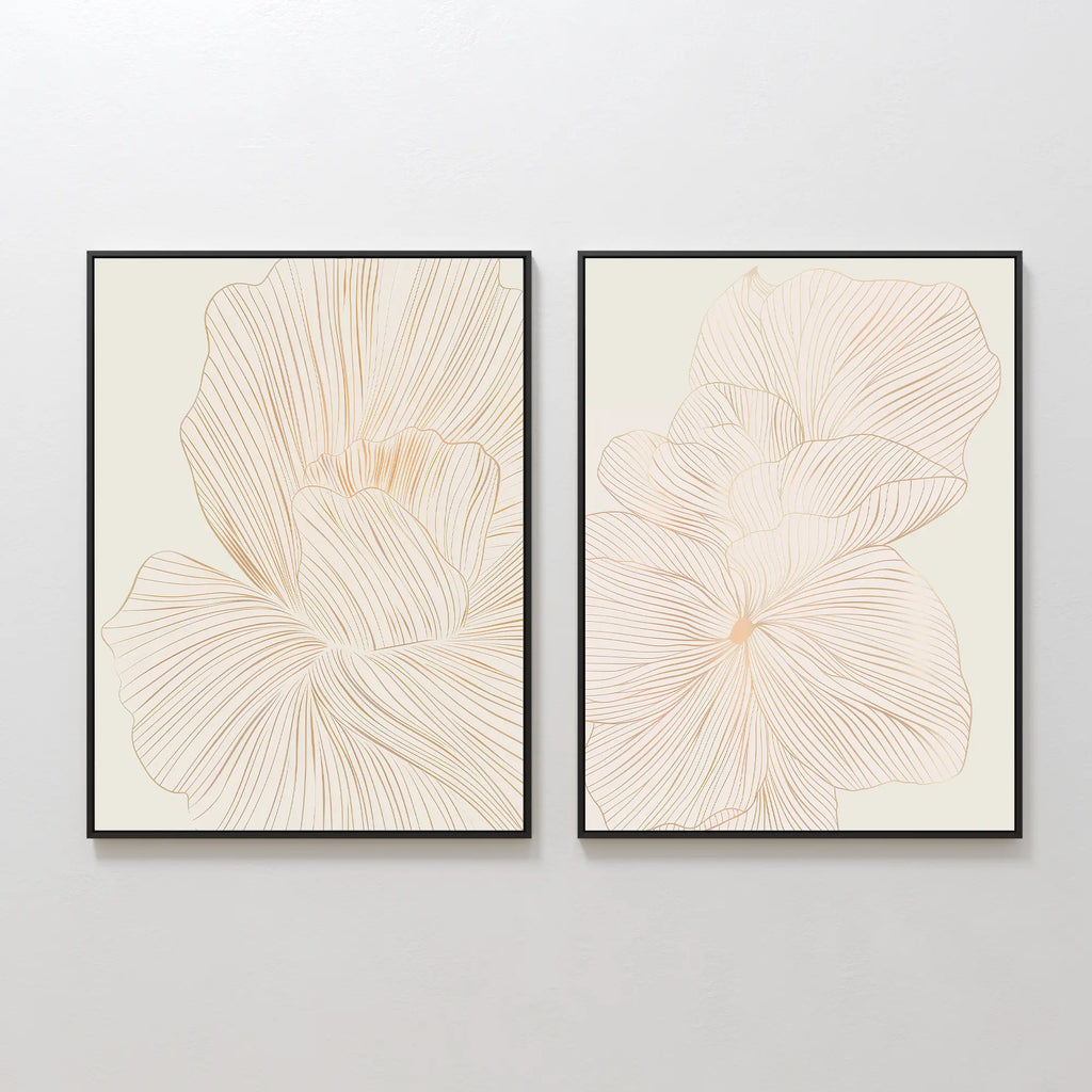 The Blush Sketch Set of 2 features framed minimalist line drawings of large beige flowers with overlapping petals—ideal modern wall art for a bedroom.