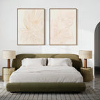 A modern bedroom with an olive green bed, white bedding, beige nightstands with matching lamps, and the Blush Sketch Set of 2 minimalist wall art hanging above the bed.