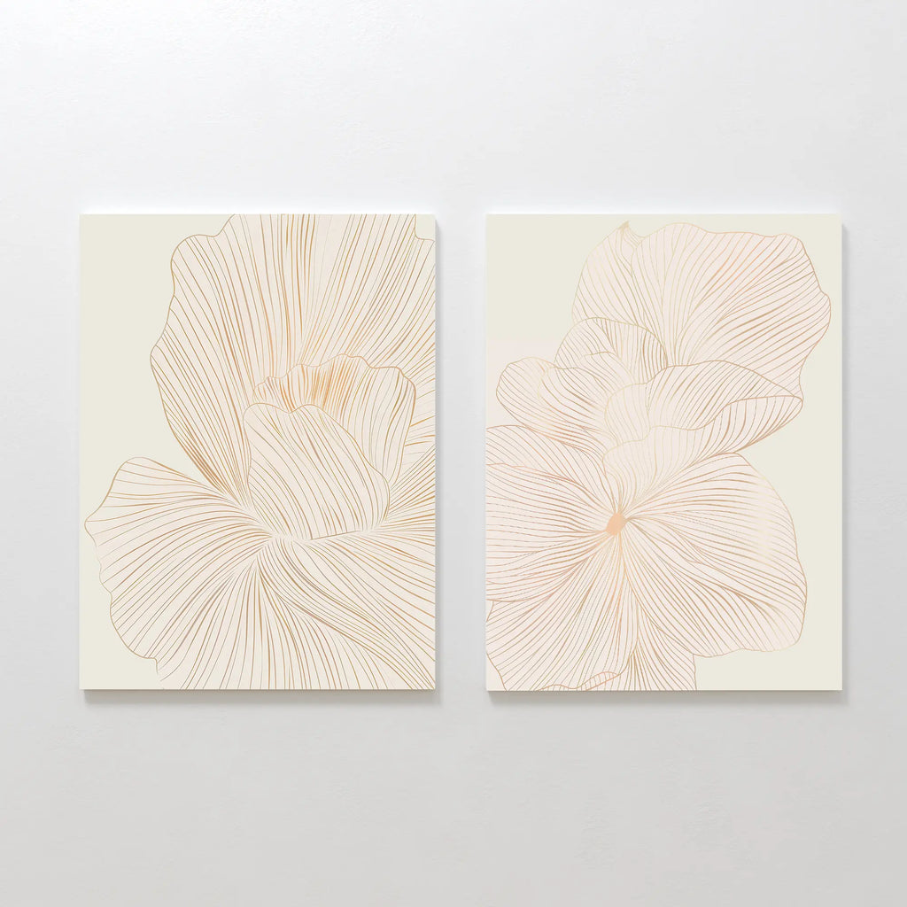 The Blush Sketch Set of 2 features minimalist art prints with delicate beige flower petal line drawings, ideal as botanical decor for a modern bedroom when displayed together on a light wall.