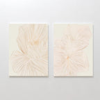 The Blush Sketch Set of 2 features minimalist art prints with delicate beige flower petal line drawings, ideal as botanical decor for a modern bedroom when displayed together on a light wall.