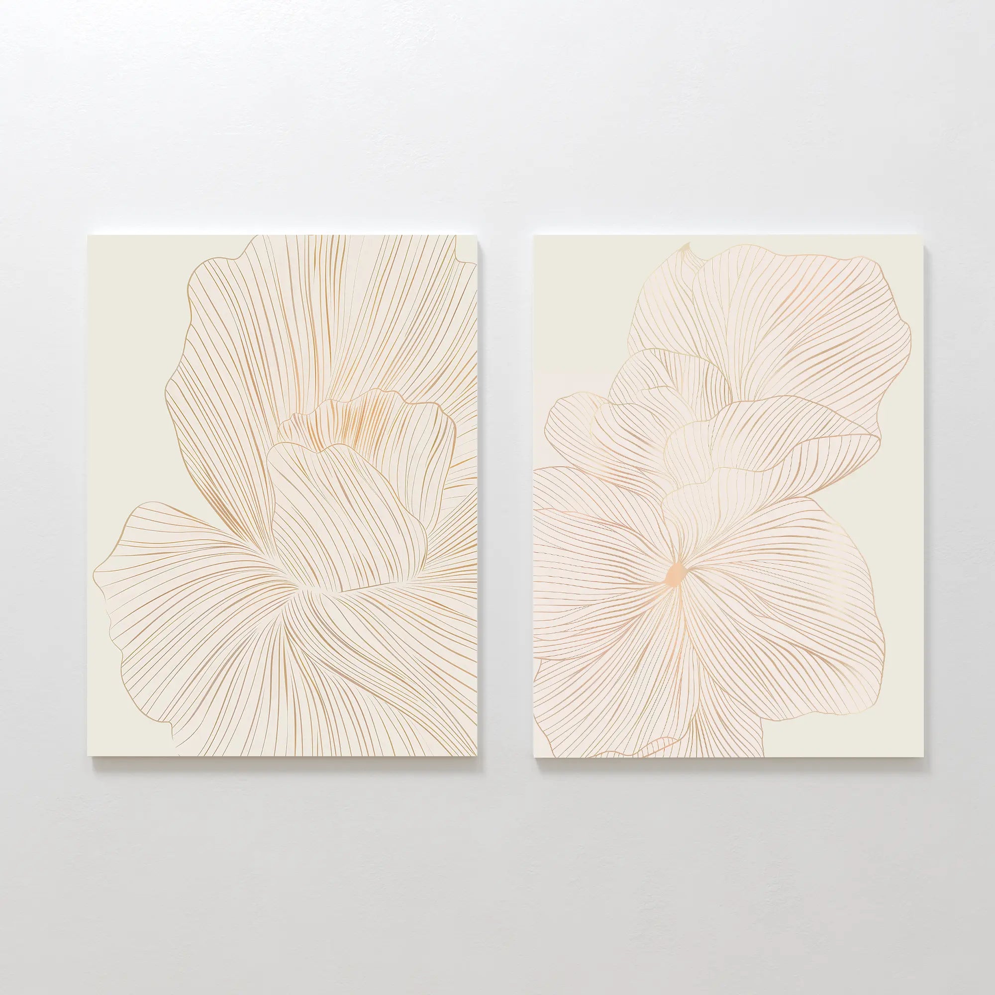The Blush Sketch Set of 2 features minimalist art prints with delicate beige flower petal line drawings, ideal as botanical decor for a modern bedroom when displayed together on a light wall.