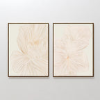 The Blush Sketch Set of 2 features minimalist wall art prints with abstract floral line drawings in soft beige, ideal for adding a modern touch to your bedroom decor.