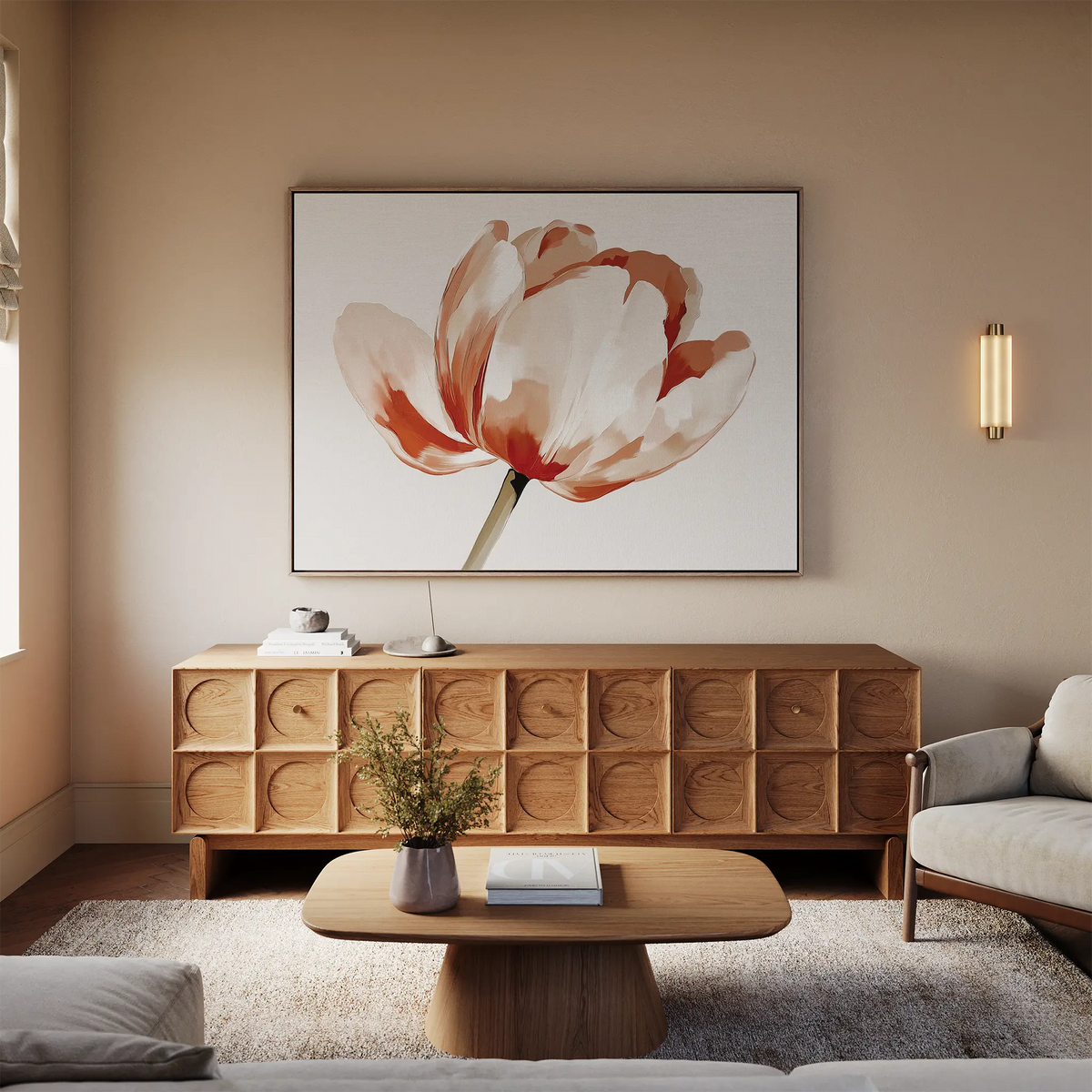 A living room with a beige sofa, wooden coffee table, and sideboard. Above the sideboard hangs the Blush Tulip Canvas Art featuring red and cream petals. Soft lighting and a vase with greenery add warmth to this inviting space.